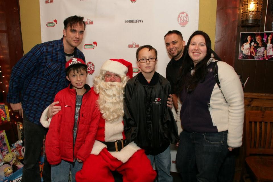Group photo with Santa at a Rock 4 Tots event